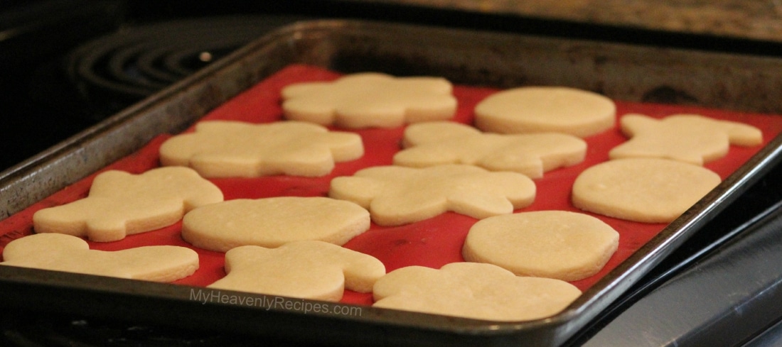 cut out sugar cookies on a baking pan, ready to be baked