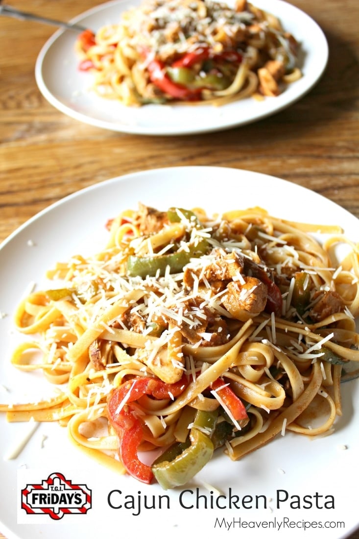 2 servings of cajun chicken pasta on white plates