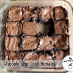 chocolate chip oreo brownies in a 8x8 baking dish with a piece missing
