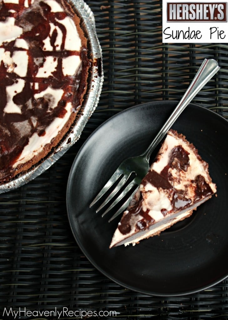 piece of hershey sundae pie on a black plate with fork and full pie in background