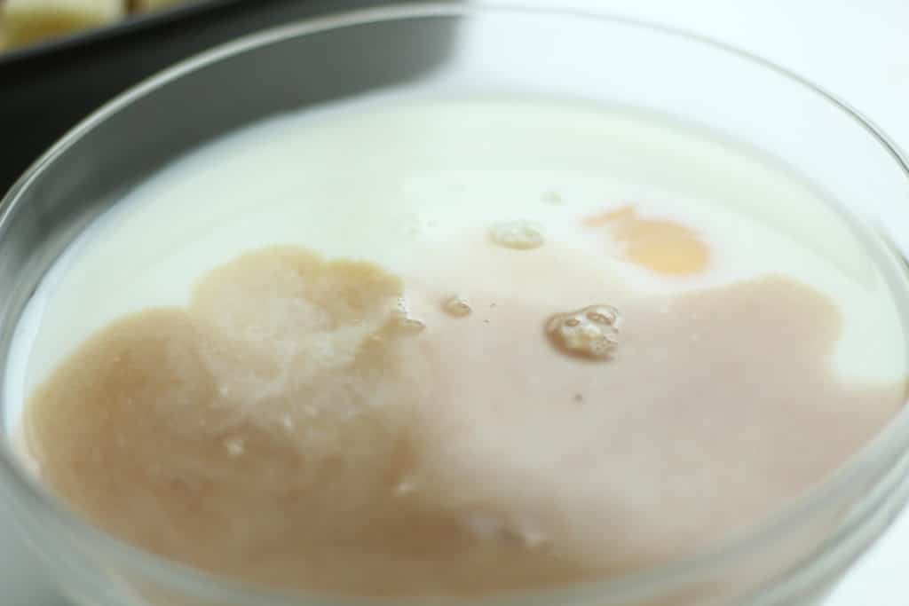 milk, eggs and vanilla in bowl for breakfast recipe