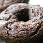 up close shot of baked chocolate donuts