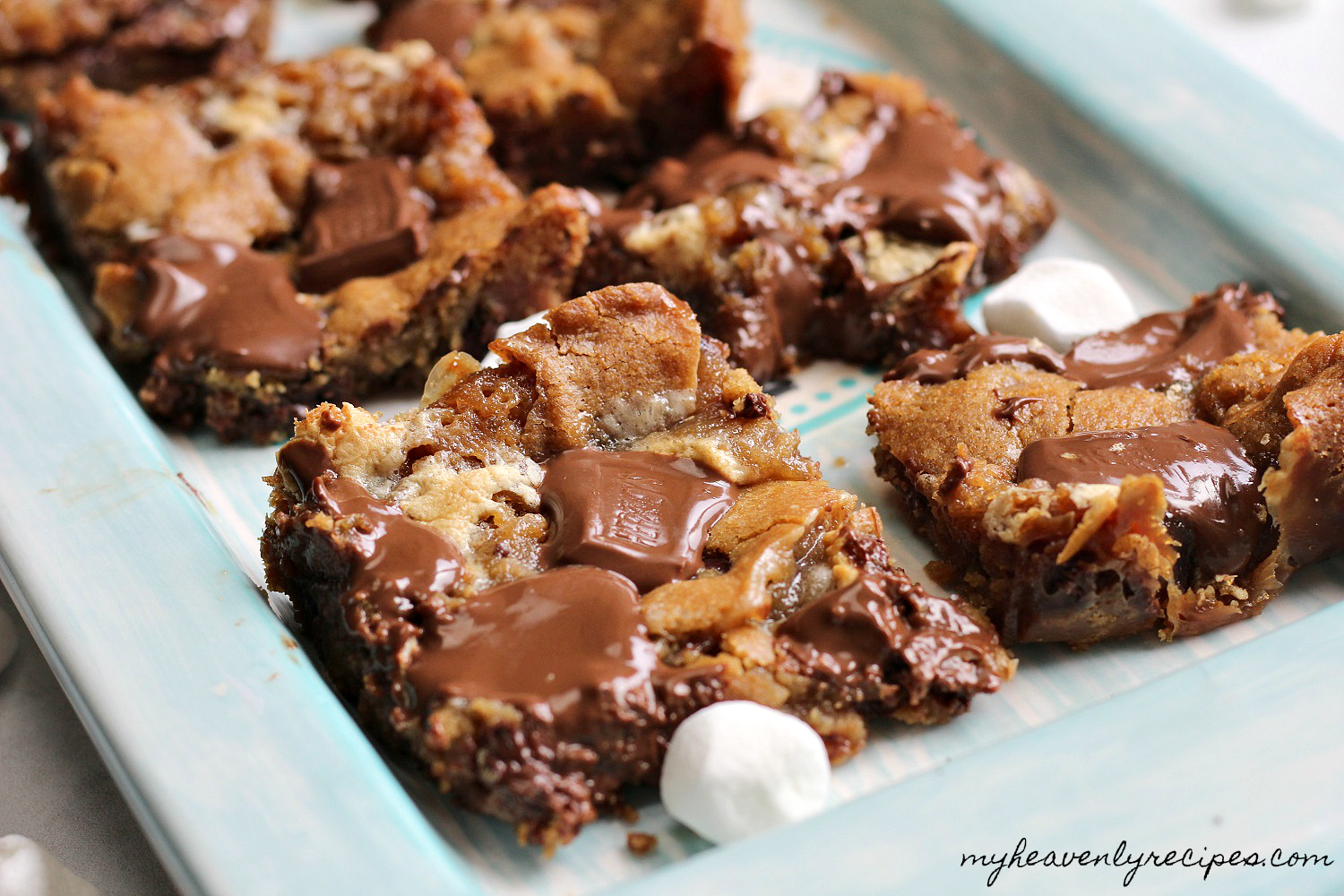 smores cookie bars on a plate with mini marshmallows