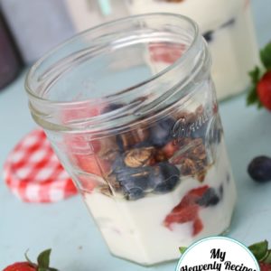 fruit parfait with yogurt, homemade granola and fresh berries, served in a mason jar