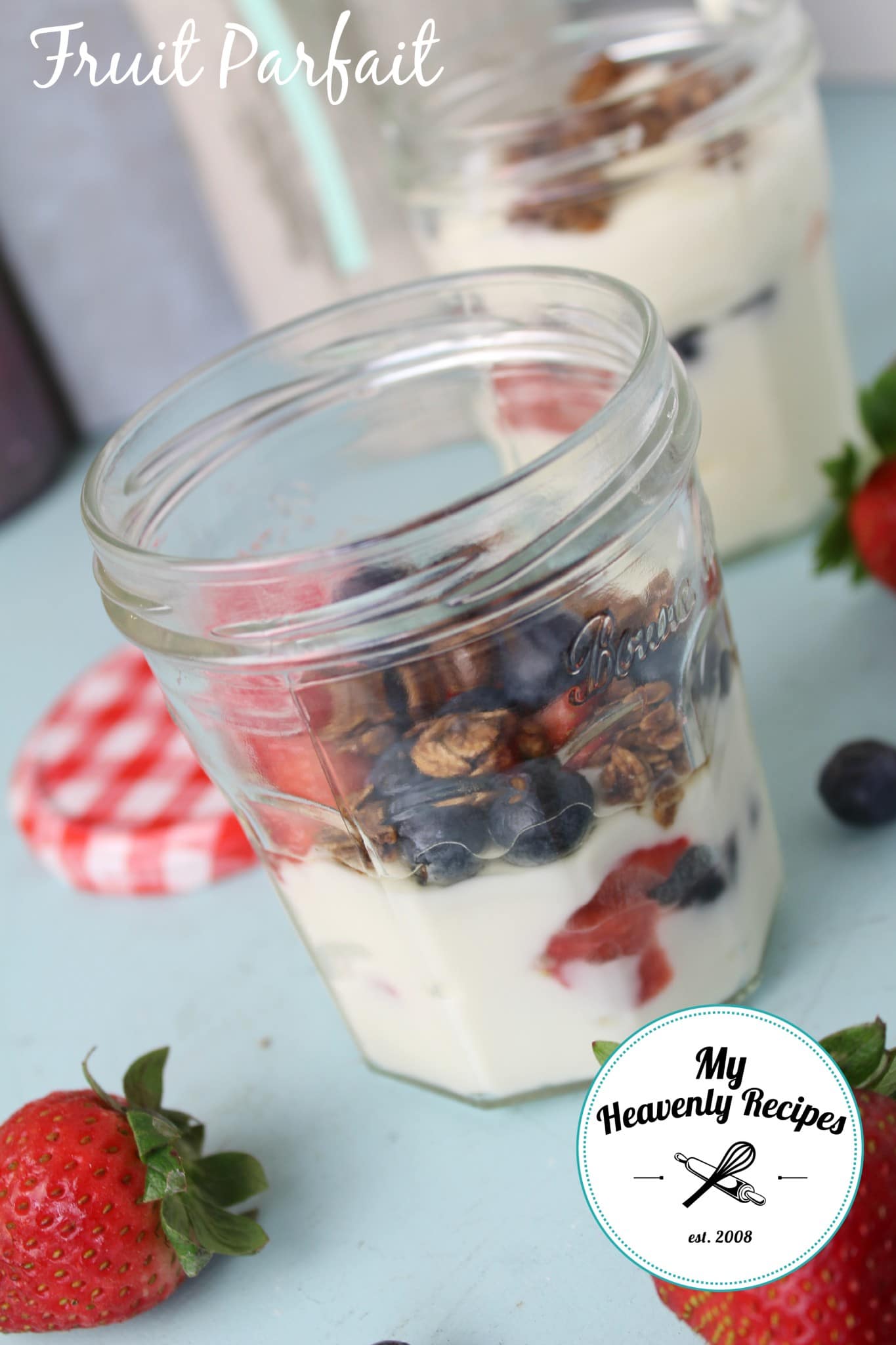 fruit parfait with yogurt, homemade granola and fresh berries, served in a mason jar