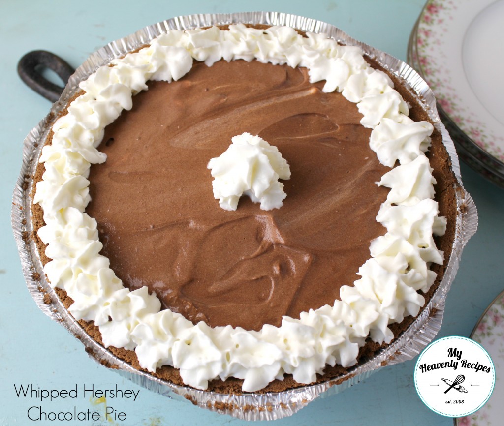 chocolate pudding pie with homemade whipped cream ran along the outside and a dab in the center
