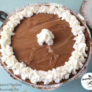 chocolate pudding pie with homemade whipped cream ran along the outside and a dab in the center