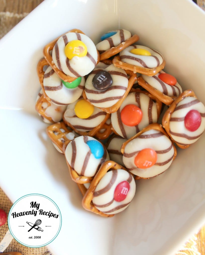 Bowl of sweet snacks made with mini pretzels, Hershey kisses and M&M candies