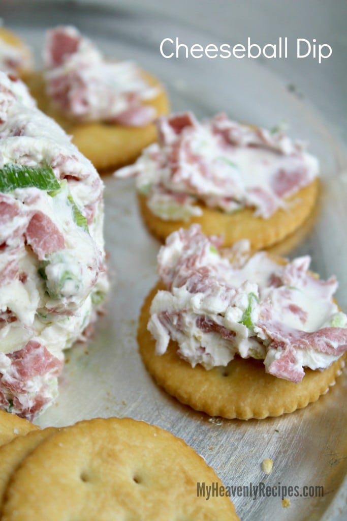 cheeseball recipe served on crackers on a silver plate