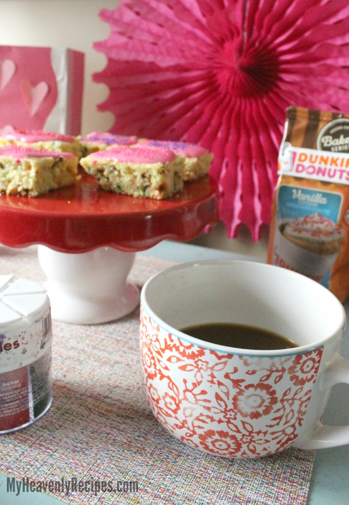Unicorn Cookie Bars next to a cup of coffee