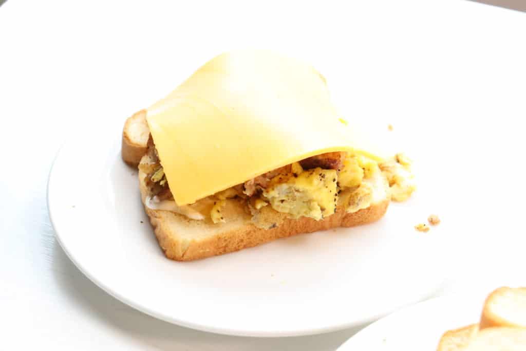 cheese on egg and sausage sandwich