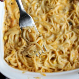 cheesy chicken spaghetti casserole on a fork