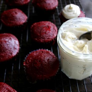 cream cheese icing recipe next to red velvet cupcakes