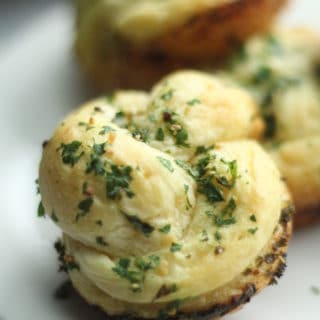 close up of garlic knots on plate