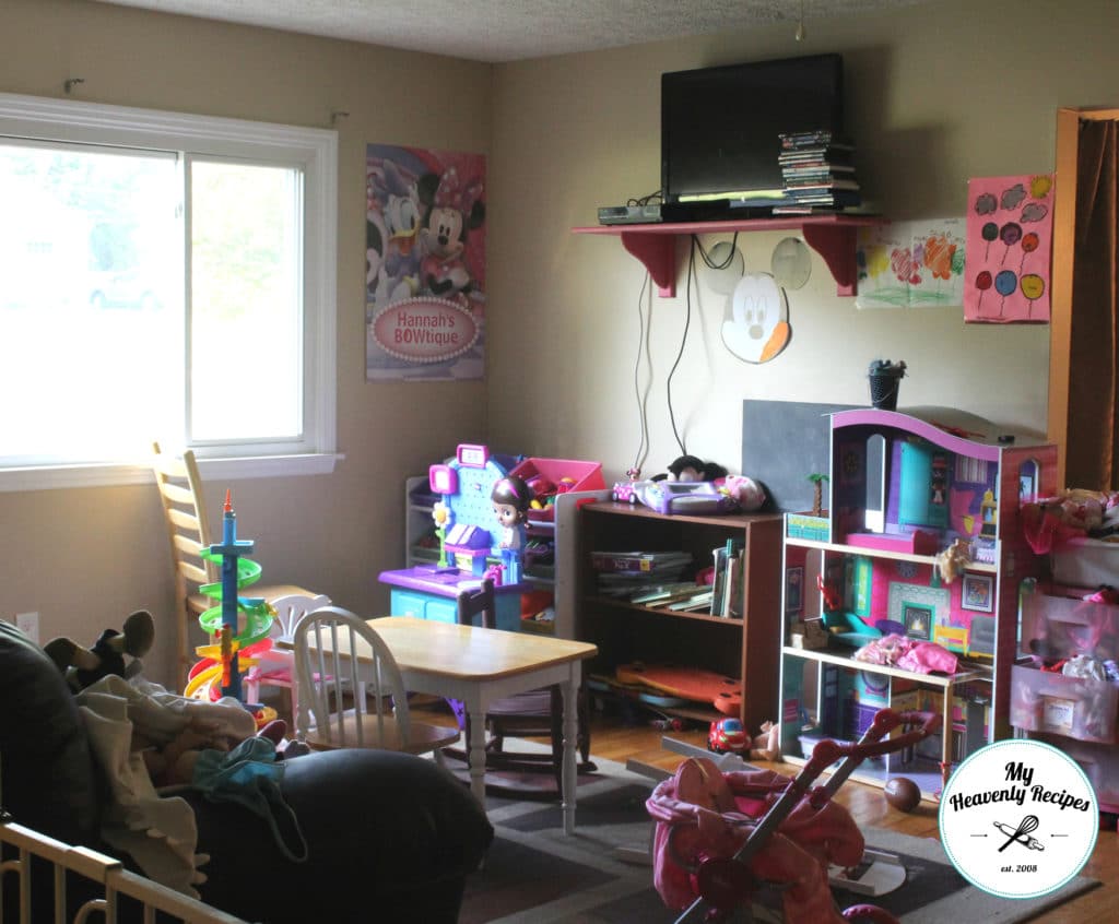 a messy playroom full of toys, books and a unusable space