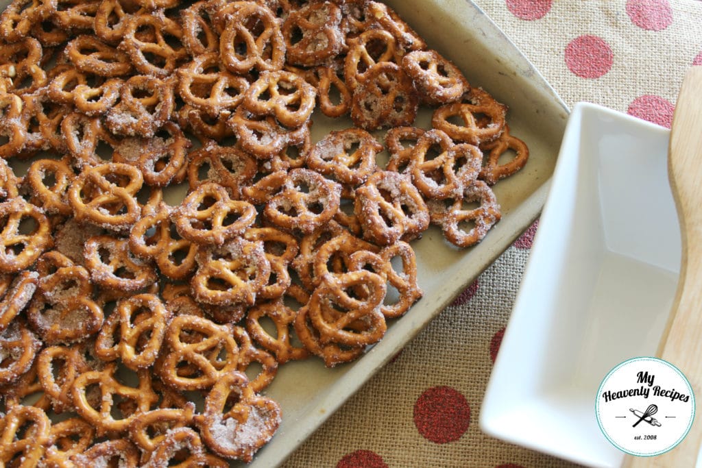 overhead view of beige tray containing seasoned cinnamon pretzels on pink polka dot mat