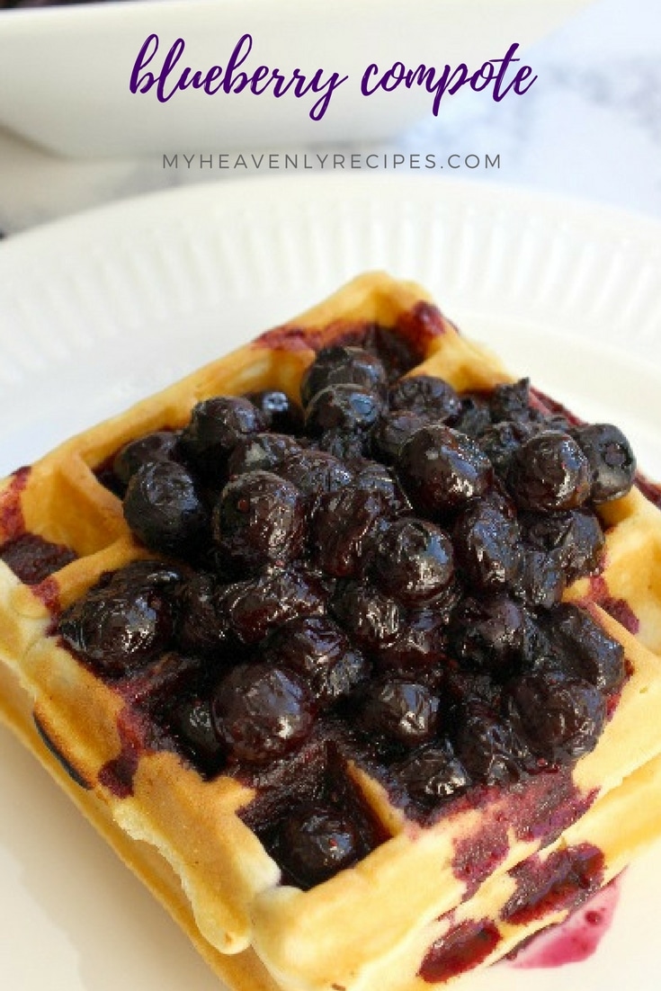 Waffles on white plate topped with blueberry compote
