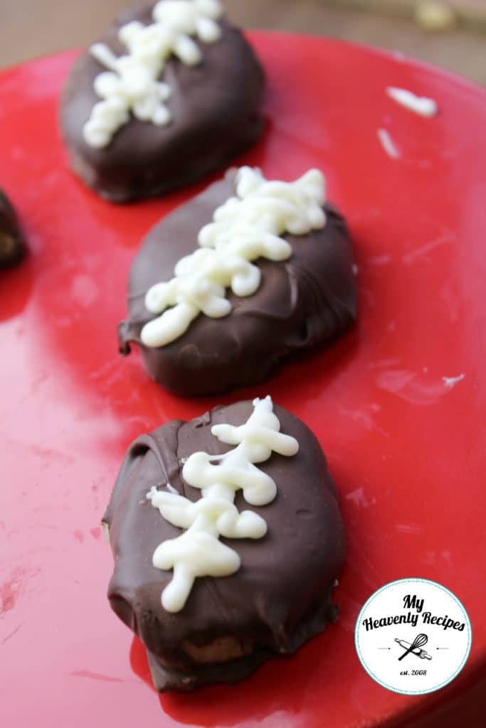 chocolate dipped footballs on red serving tray