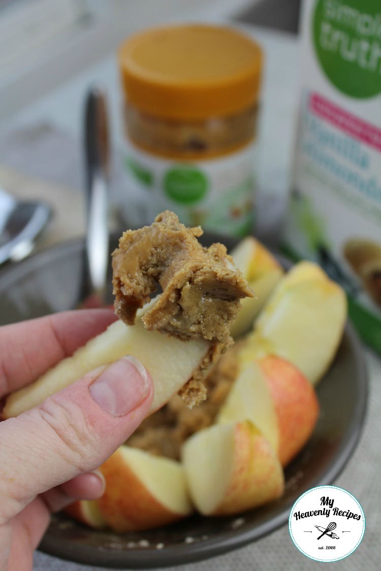 healthy peanut butter dip on apple slices (made with vanilla Shakeology)