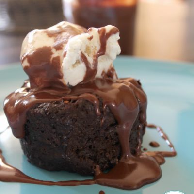 chocolate mug cake topped with vanilla ice cream