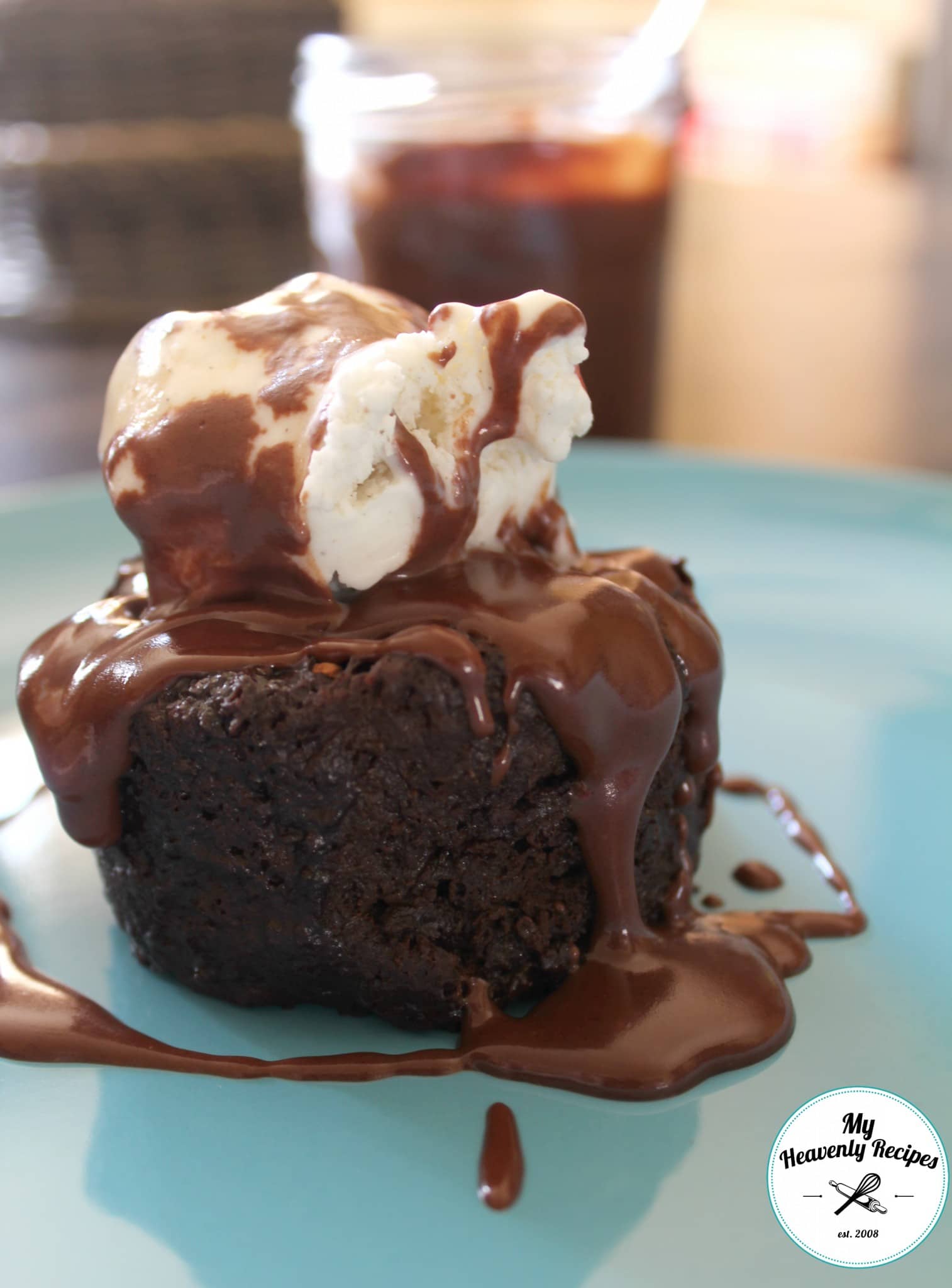 moist chocolate microwave cake topped with ice cream and chocolate sauce