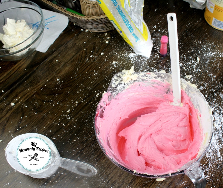 bowl of pink buttercream frosting
