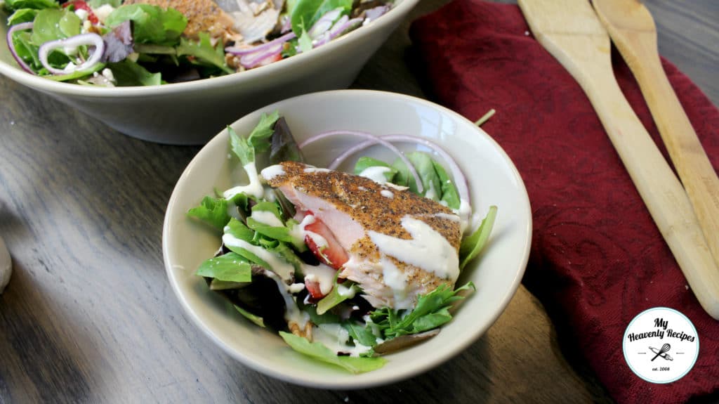 bowl of salmon salad with fresh strawberries