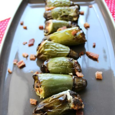 Bacon Stuffed Jalapeno Peppers cooked on a serving platter