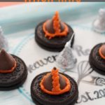 oreo cookie with hershey kiss and orange icing to create witch hats for a halloween snack