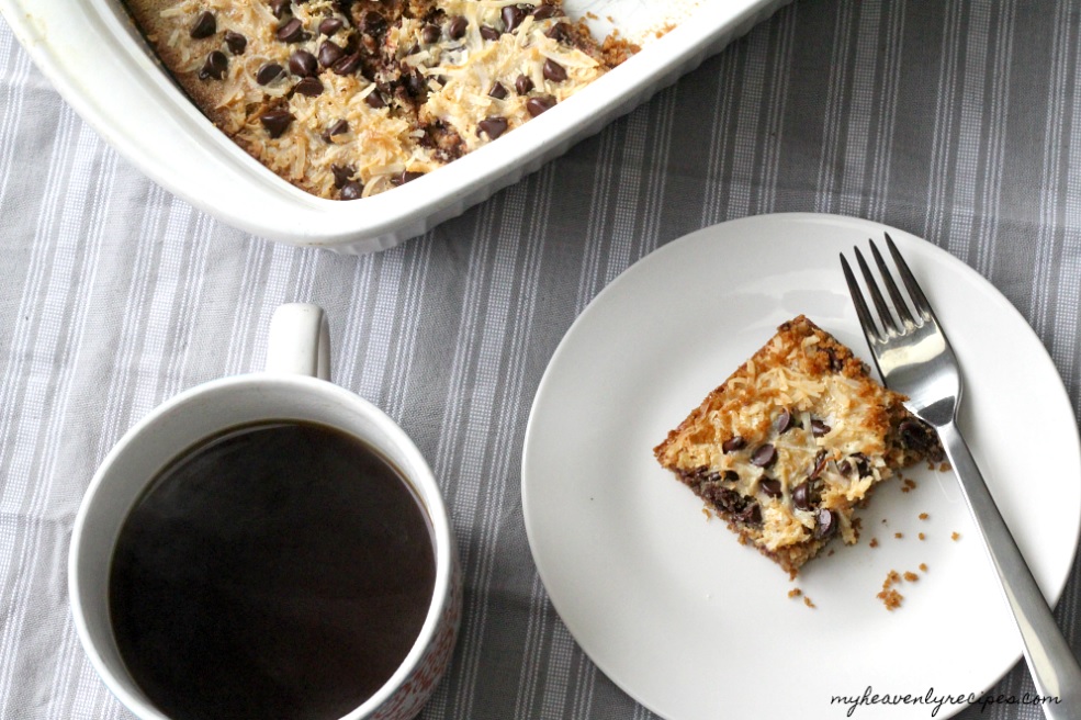 Magic Bars plated with coffee and peak of baking dish