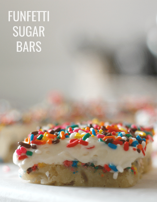 funfetti sugar cookie bar single side view with blurred background