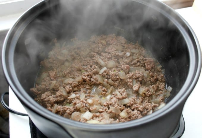 low carb taco soup in a pot with beef and onions