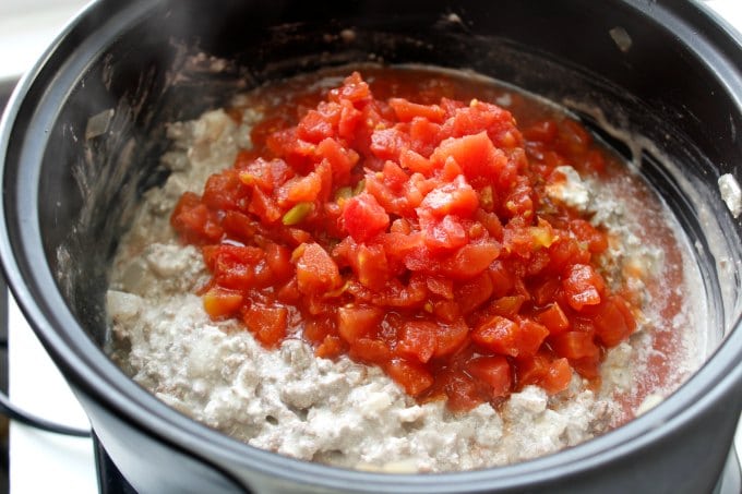 tomatoes added to top of low carb taco soup in pot