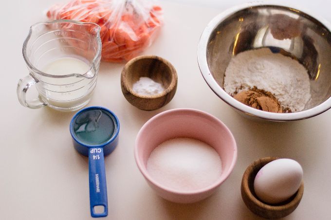 ingredients used in easter cupcakes including an egg, sugar, and flour