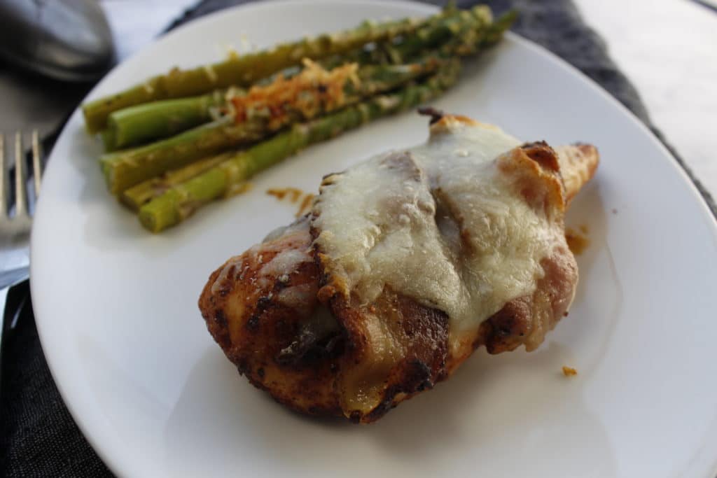 chicken on a plate with asparagus