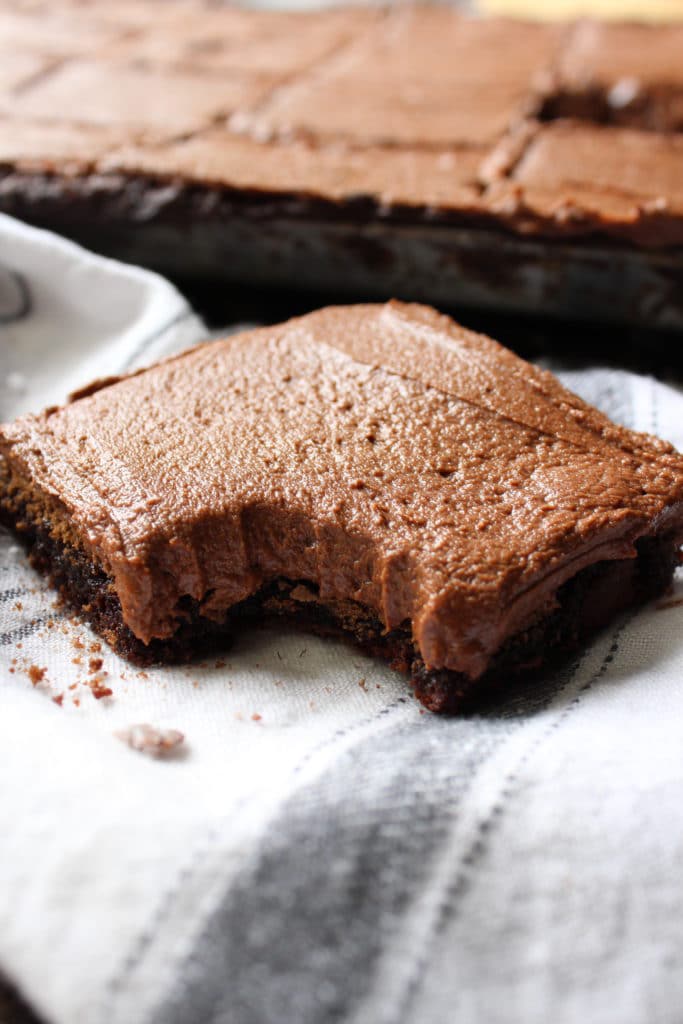 overhead shot of fudgy brownie recipe with bite out of brownie