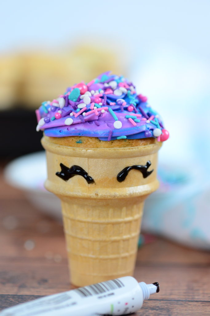 head on shot of unicorn cupcake in ice cream cone