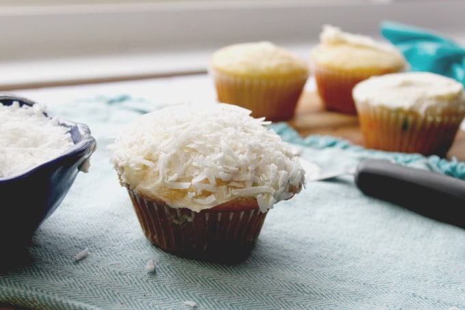 easter cupcake on light colored towel with coconut flakes on top