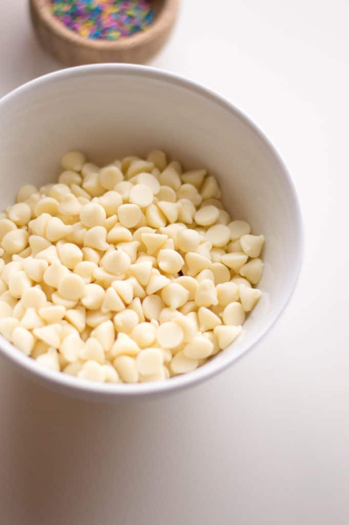 closeup of white bowl with white chocolate chips