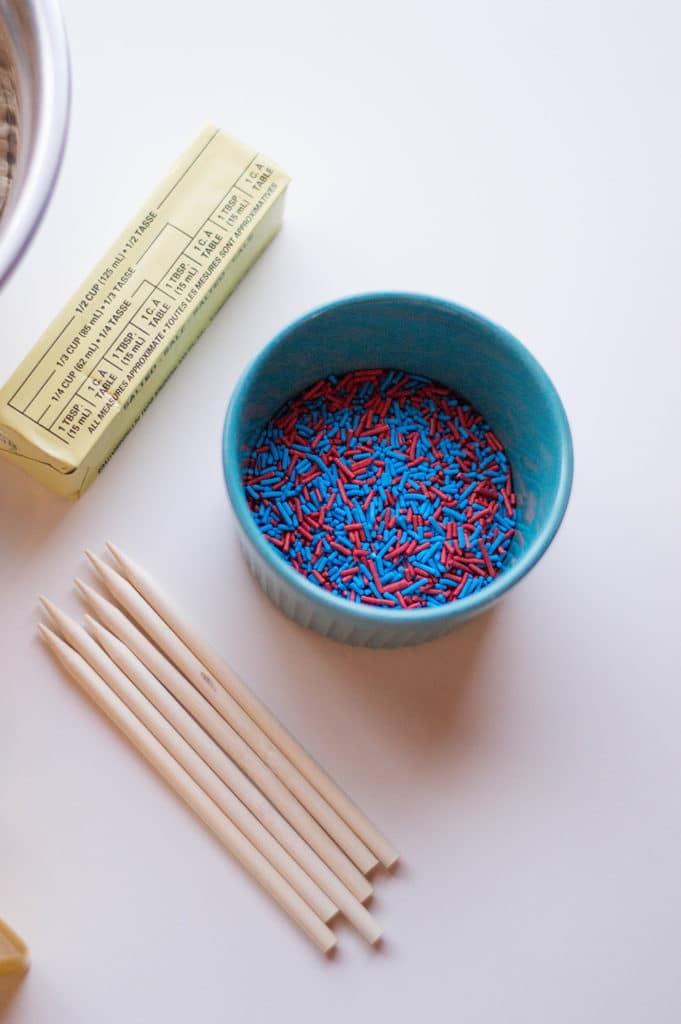bowl with red and blue sprinkles with butter