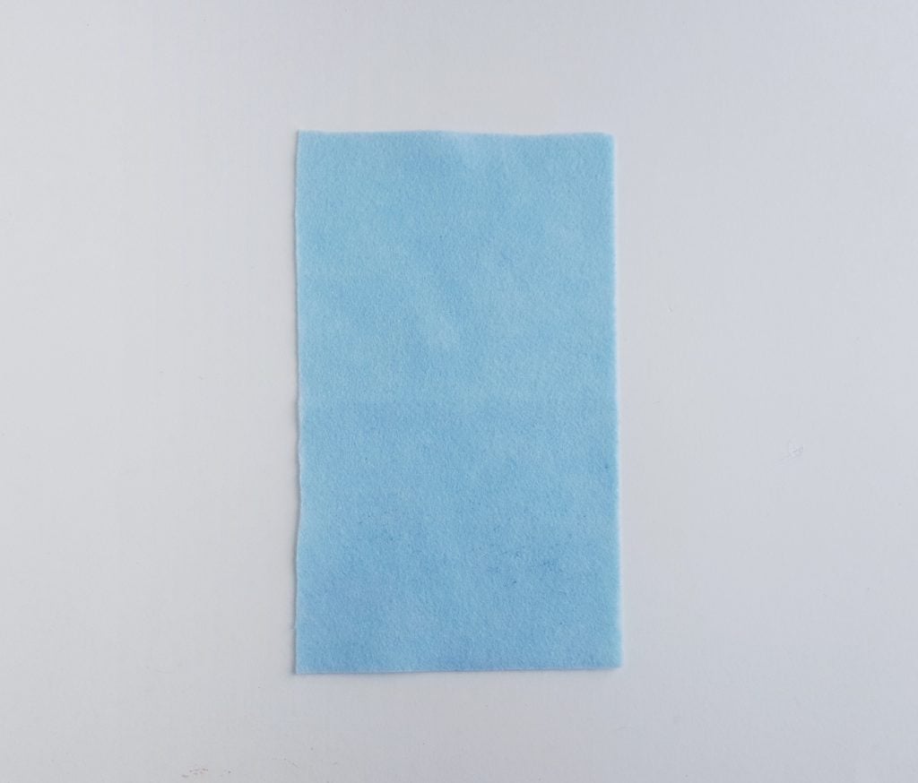 blue fabric rectangle to be used in a unicorn pencil case