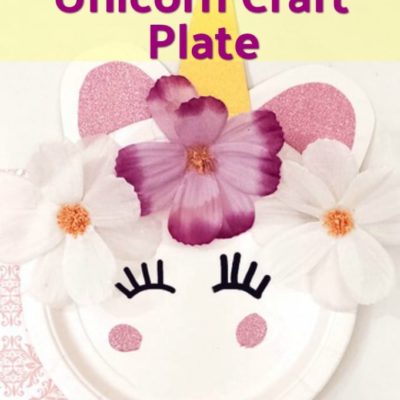 closeup of decorative unicorn craft plate with flowers glued on