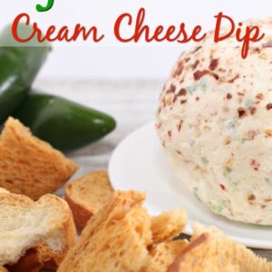 jalapeno cream cheese dip on a plate next to peppers