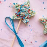 patriotic rice krispies treats on a stick with blue ribbon