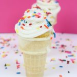 how to make ice cream cone cupcakes with sprinkles on top in front of pink background