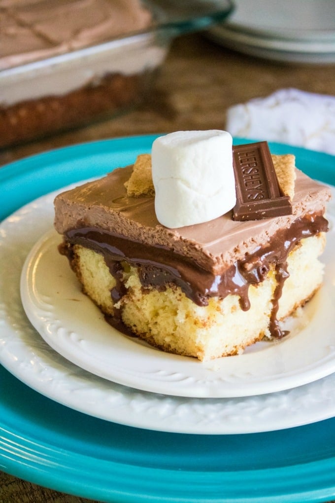 closeup of smores cake square piece on three plates