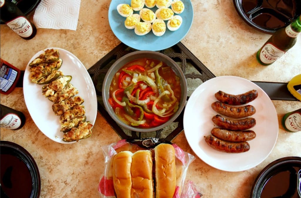 top view of grilled bell peppers and yuengling beer smothered brats