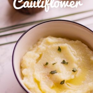 mashed cauliflower in bowl with spoon