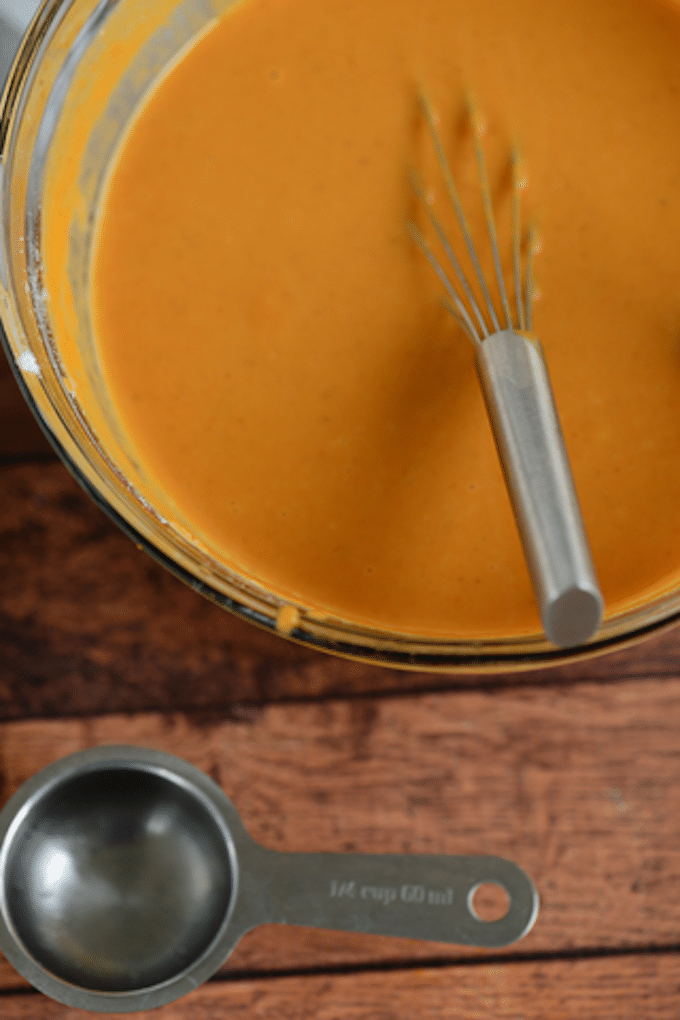 First, start by mixing your pumpkin pie filling with your eggs and evaporated milk. Mix all together until combined well. Set aside.