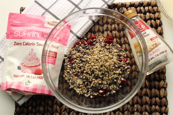 In a large bowl add coconut flakes, cranberries, sunflower seeds and chocolate chips.